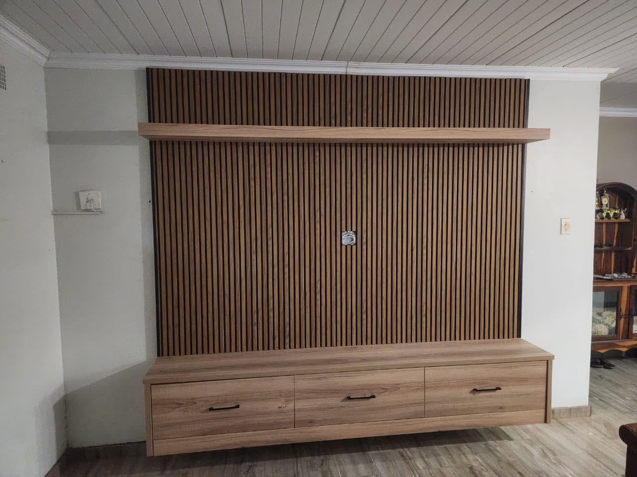 Oak slat TV feature wall with floating drawer console