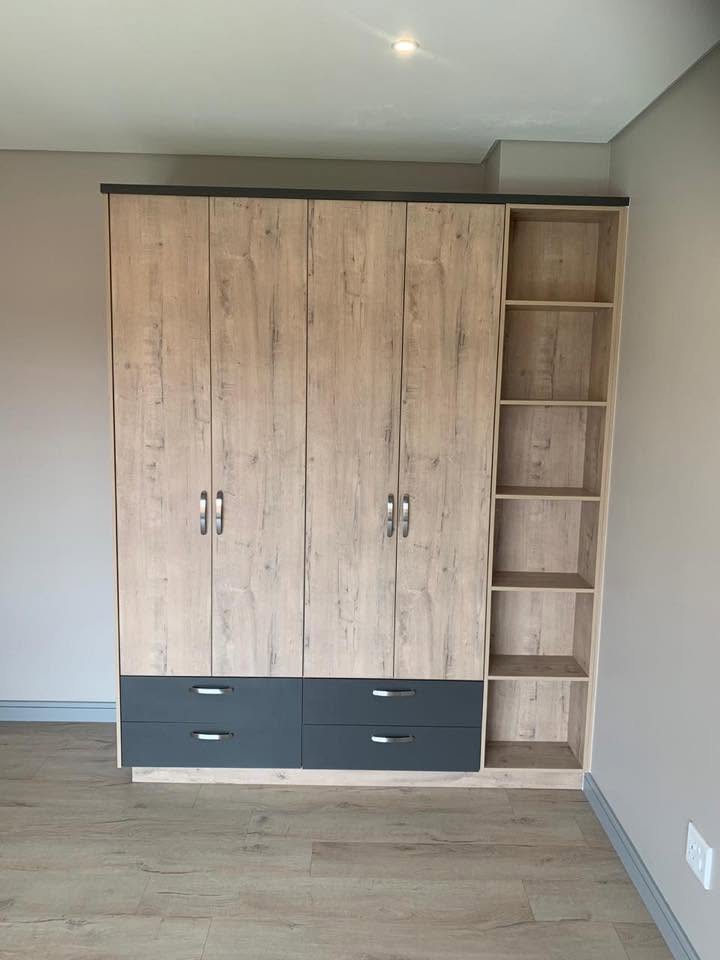 Oak and graphite four-door cupboards with open shelving tower