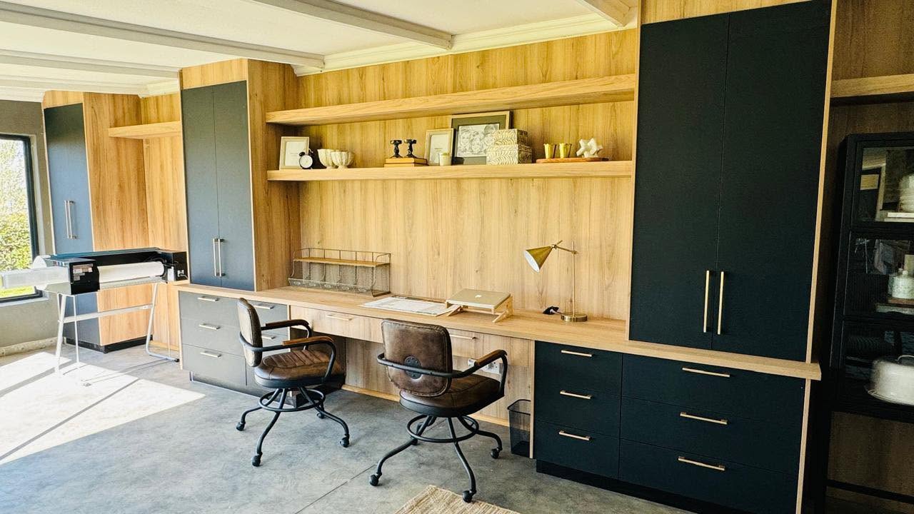 Custom home office with oak desk, dual workstations and two-tone cupboards