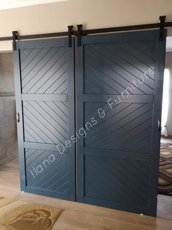 Navy blue diagonal-clad double barn sliding doors