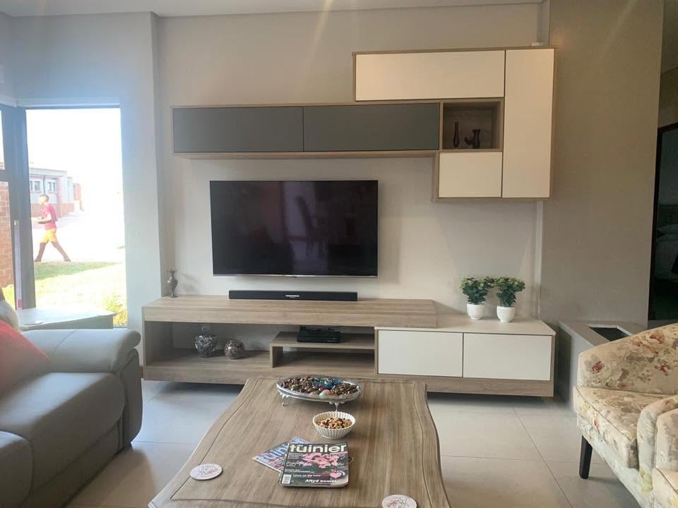 Floating oak and white TV wall unit with open shelving