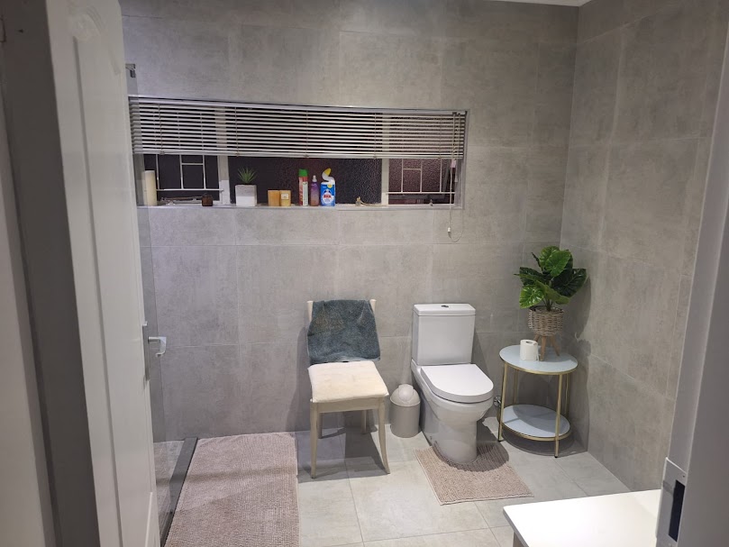 Large-format grey tile flooring in modern bathroom