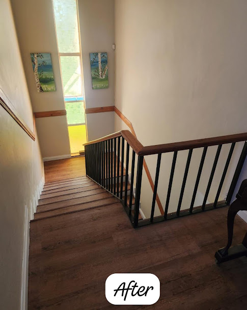 Dark oak laminate flooring on staircase and landing
