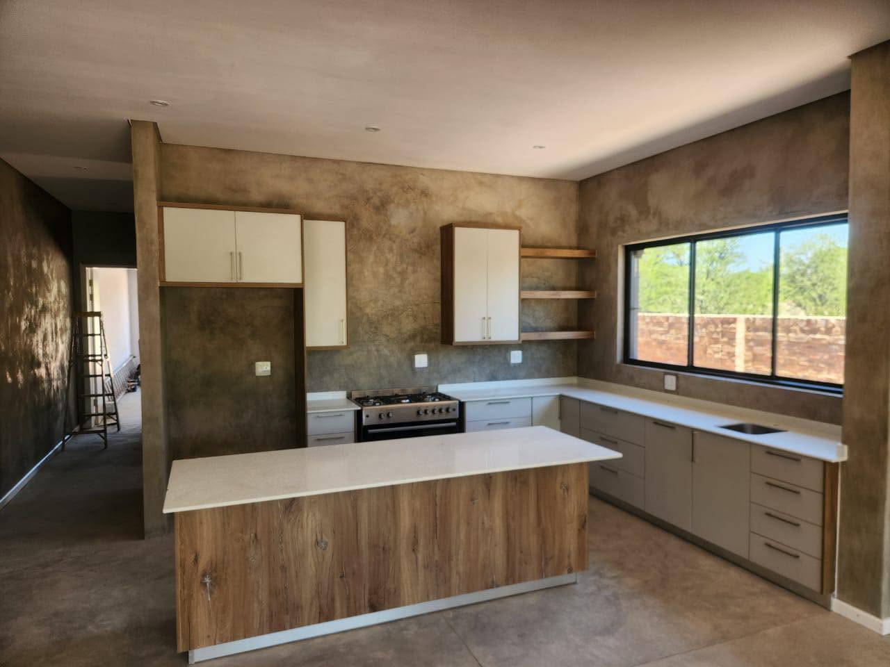 Modern kitchen with timber island and white cabinetry